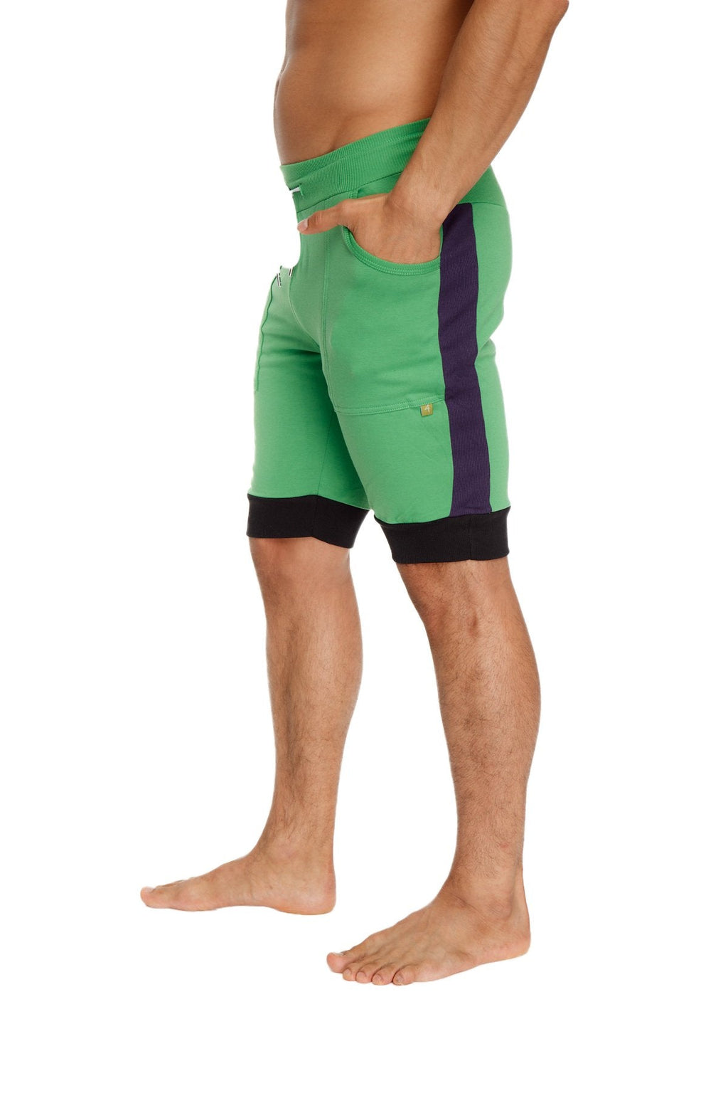 Green cuffed yoga shorts with purple side stripe and black waistband and hem trim for athletic wear