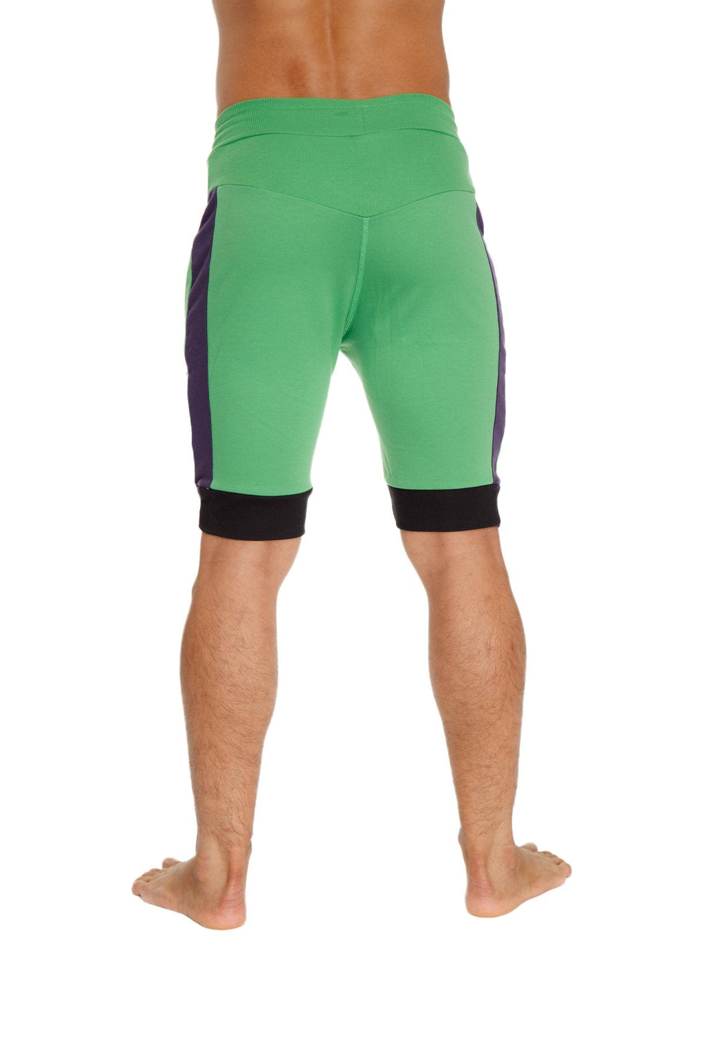 Green cuffed yoga shorts with purple side panels and black waistband and cuff trim for athletic use