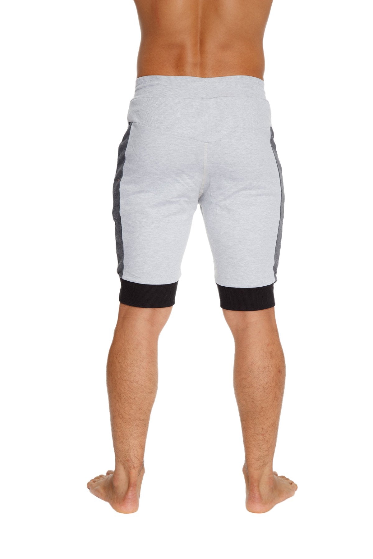 Light gray cuffed yoga shorts with dark gray side panels and black elastic cuffs for athletic use