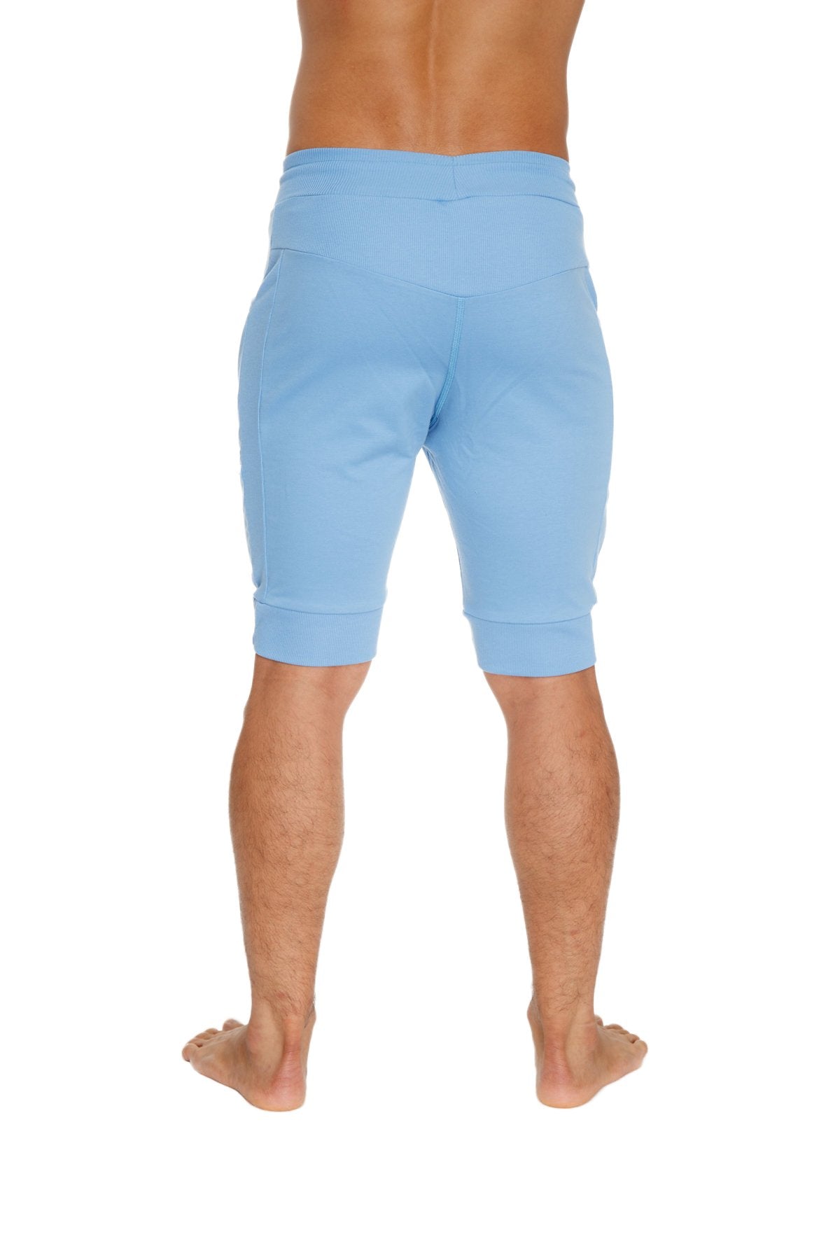 Light blue cuffed yoga shorts made of soft fabric with elastic waistband and rolled cuffs for comfortable wear