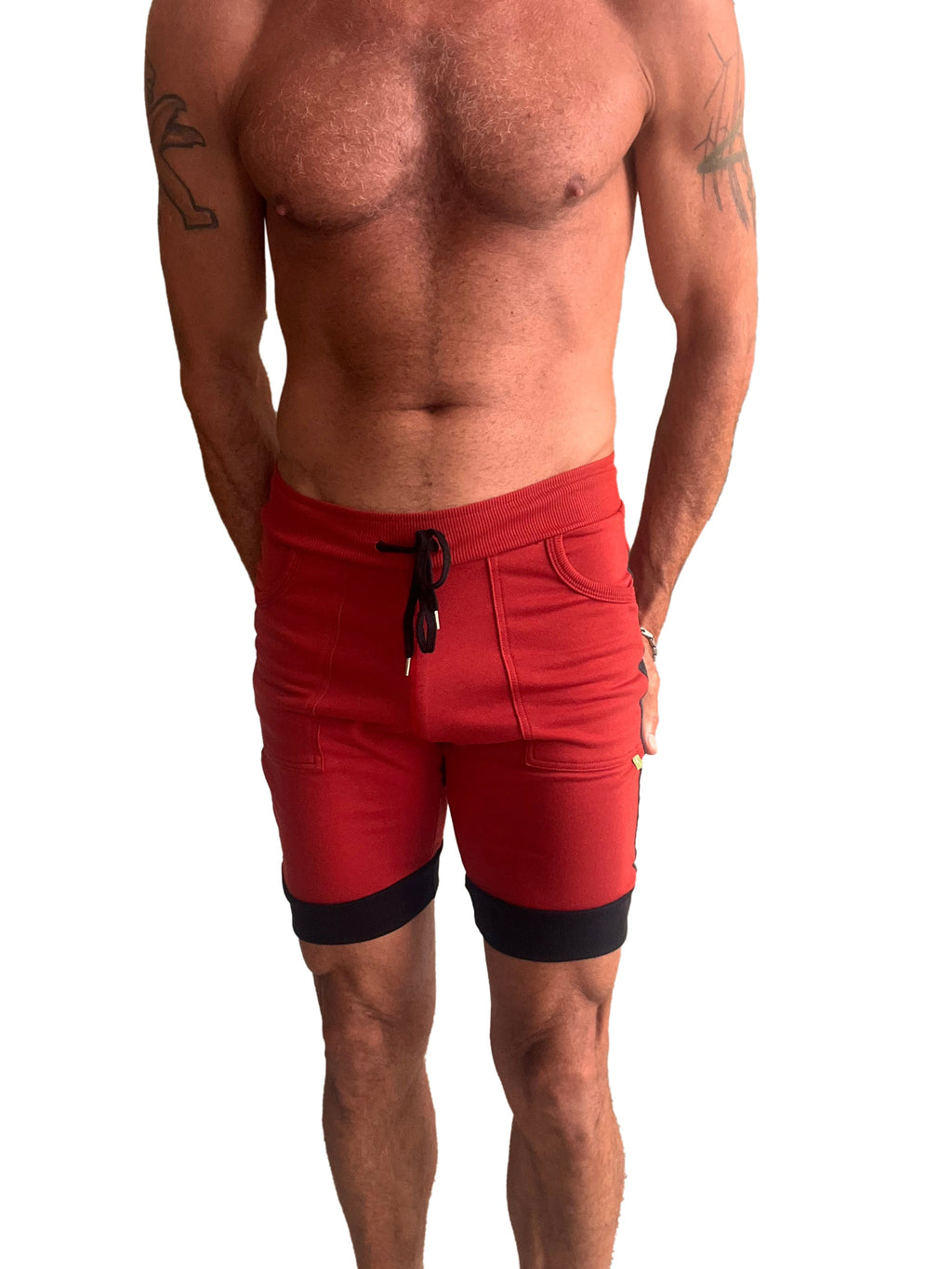 Red cuffed yoga shorts with charcoal and black trim and drawstring waistband for athletic use