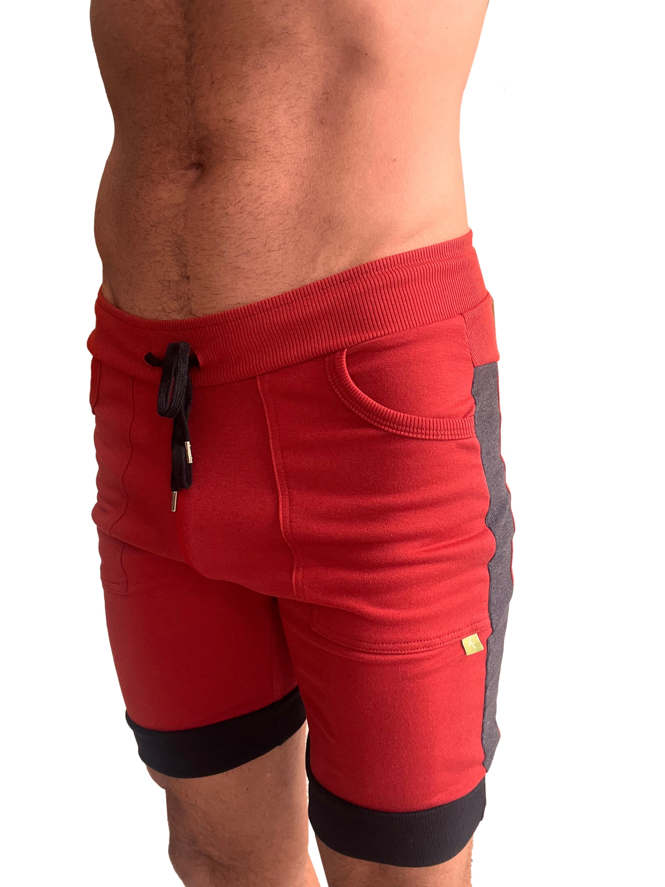 Cuffed yoga short in red with charcoal and black featuring ribbed waistband black drawstring and gray side panels