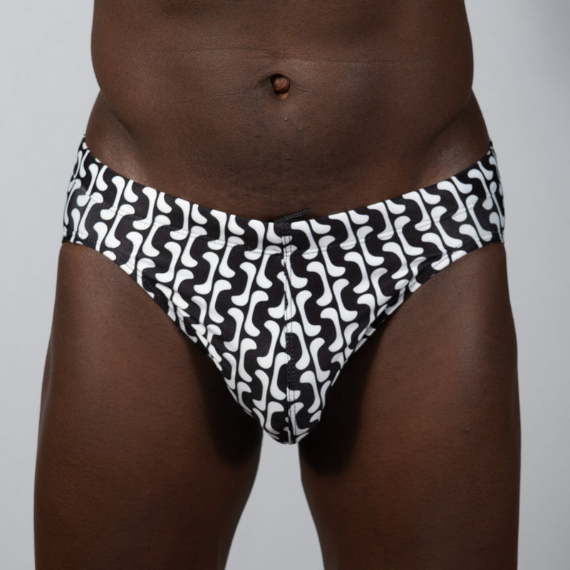 Curves print brief black and white swim trunks with bold wavy geometric pattern for stylish beachwear