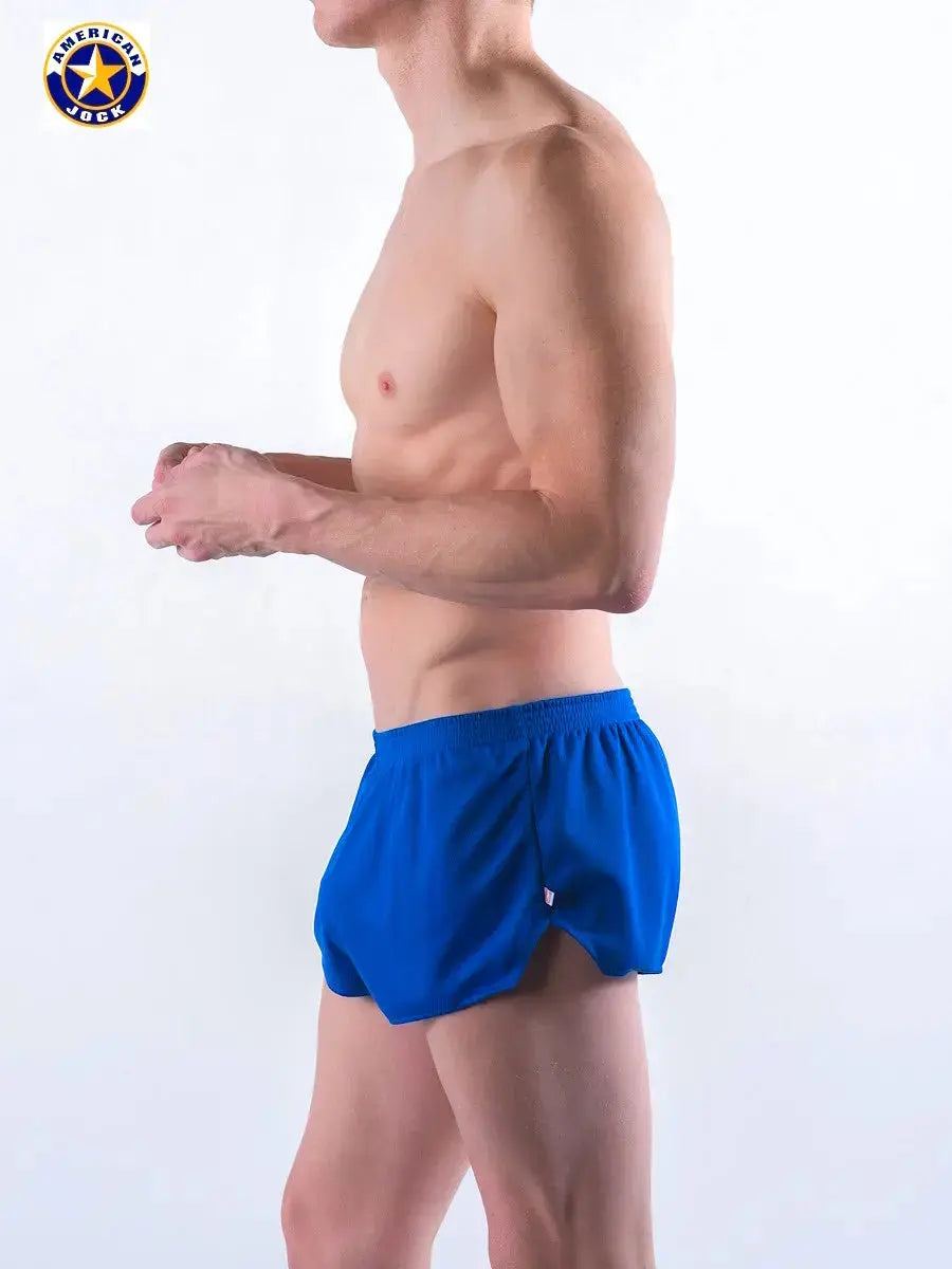 Royal blue men's running shorts by AMERICAN JOCK featuring a lightweight design and elastic waistband shown on a model.