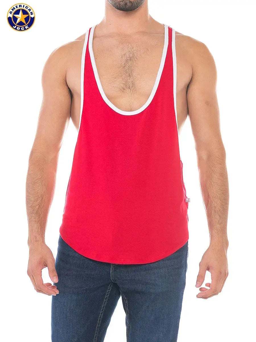 Red sports stringer tank top by AMERICAN JOCK featuring a deep scoop neckline and contrasting white trim worn by a model.