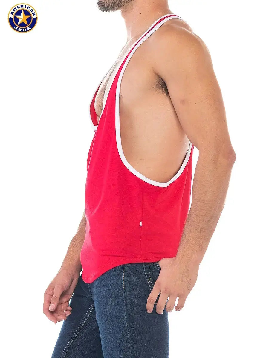 Red sports stringer tank top with white trim made of soft fabric shown on a model from the side by AMERICAN JOCK
