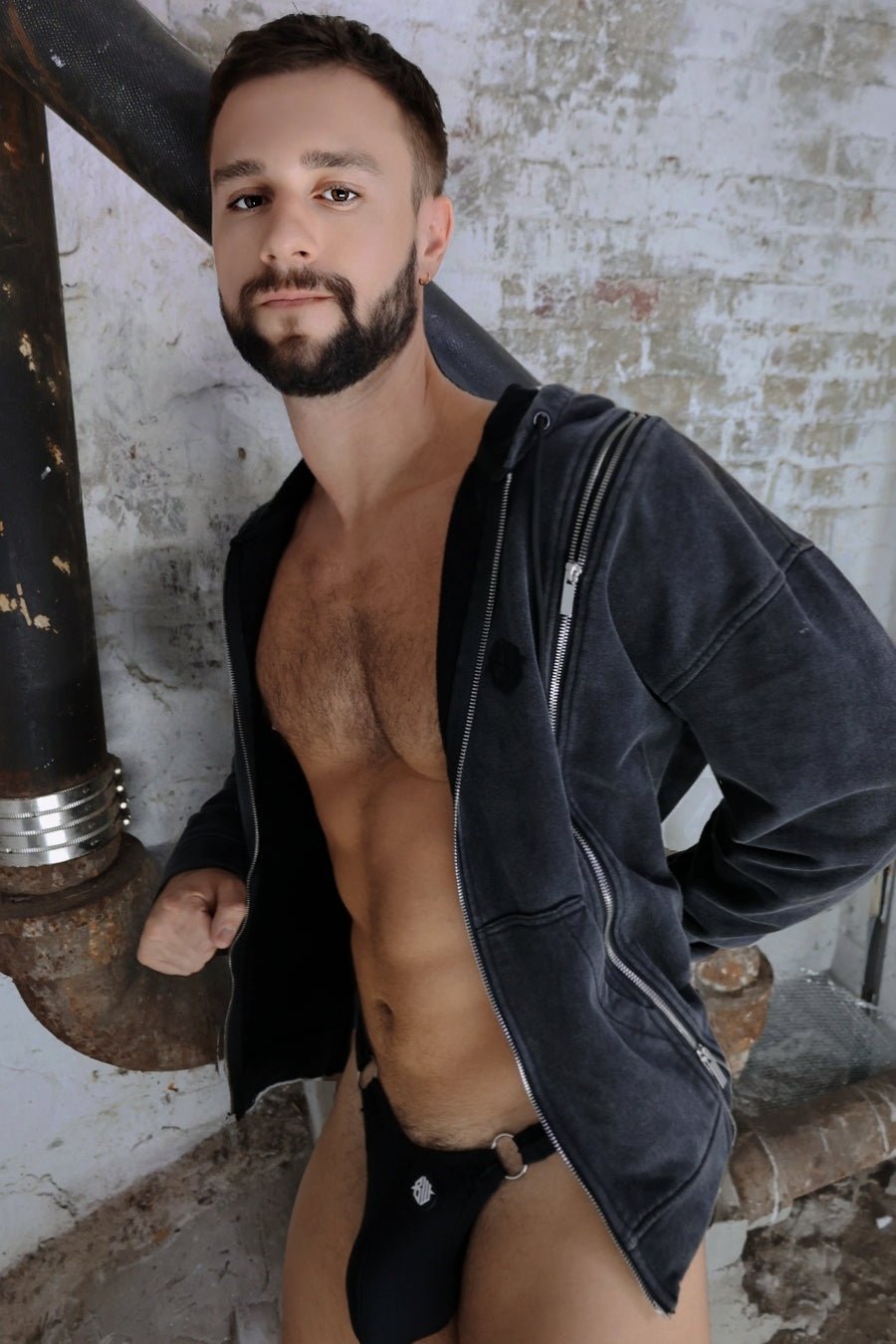 Black velvet darkroom hoodie with silver zippers paired with matching briefs featuring a small metallic emblem