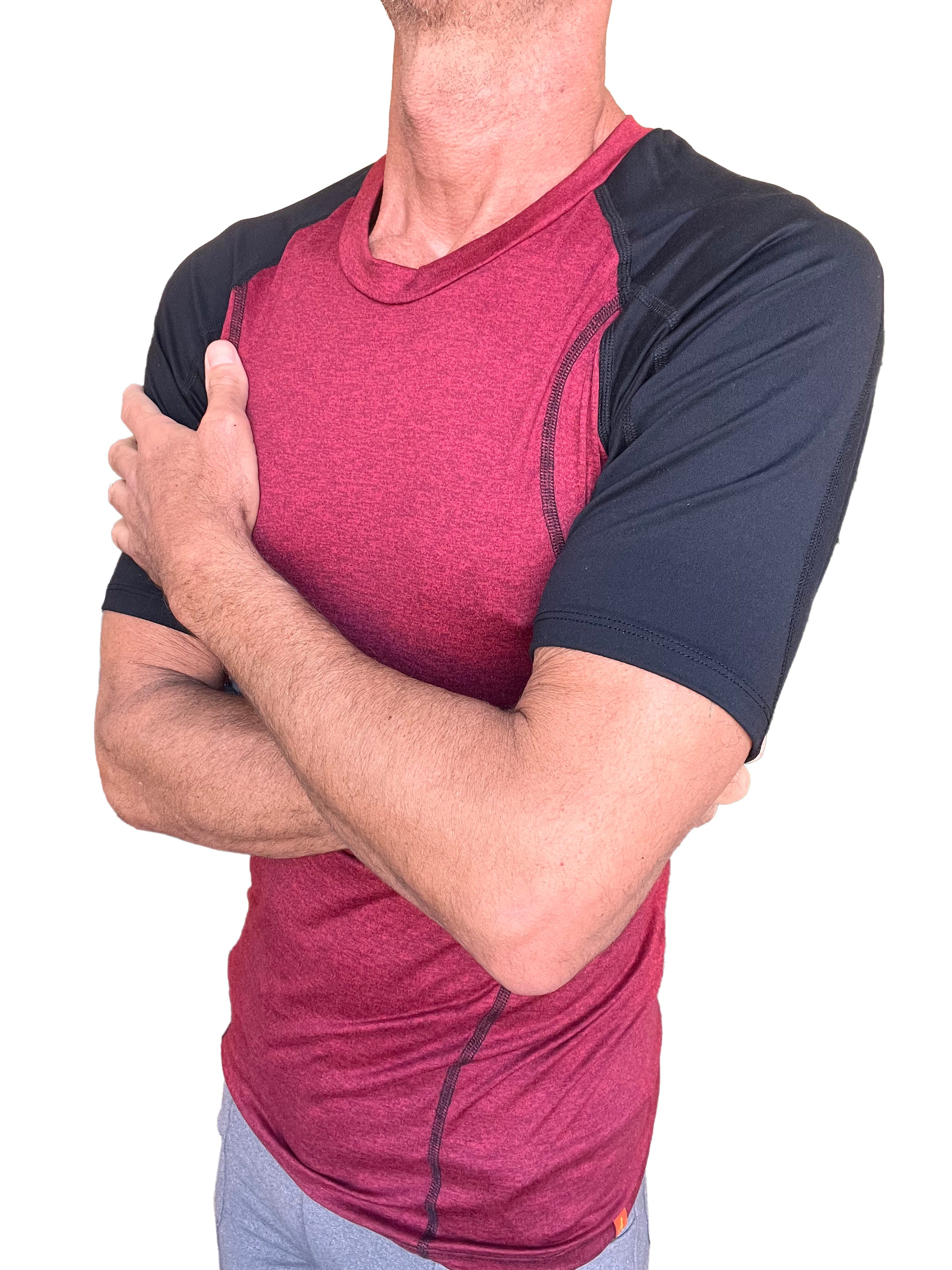 Designer raglan crew-neck tee brick with black sleeves in maroon and black with subtle seam detailing for athletic wear