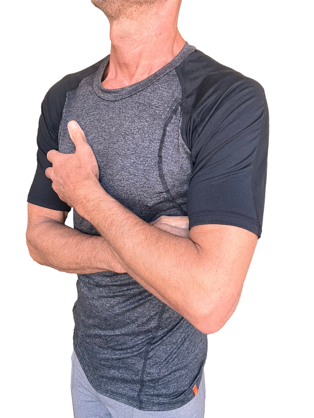 A men’s designer raglan crew-neck athletic tee with heathered gray torso and solid black sleeves with seam detailing
