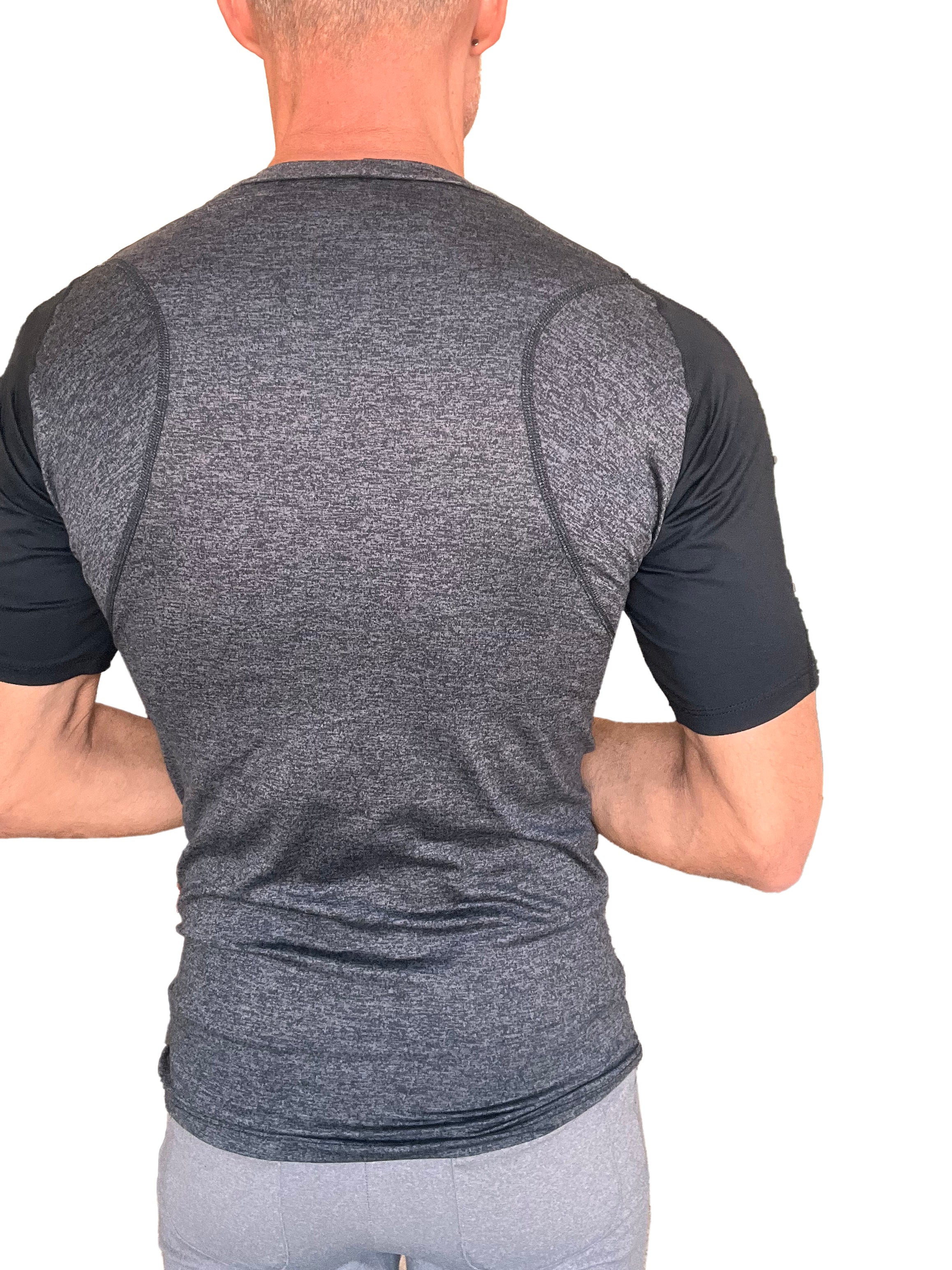 A men’s designer raglan crew-neck tee with heathered charcoal body black sleeves and seam detailing for performance fit