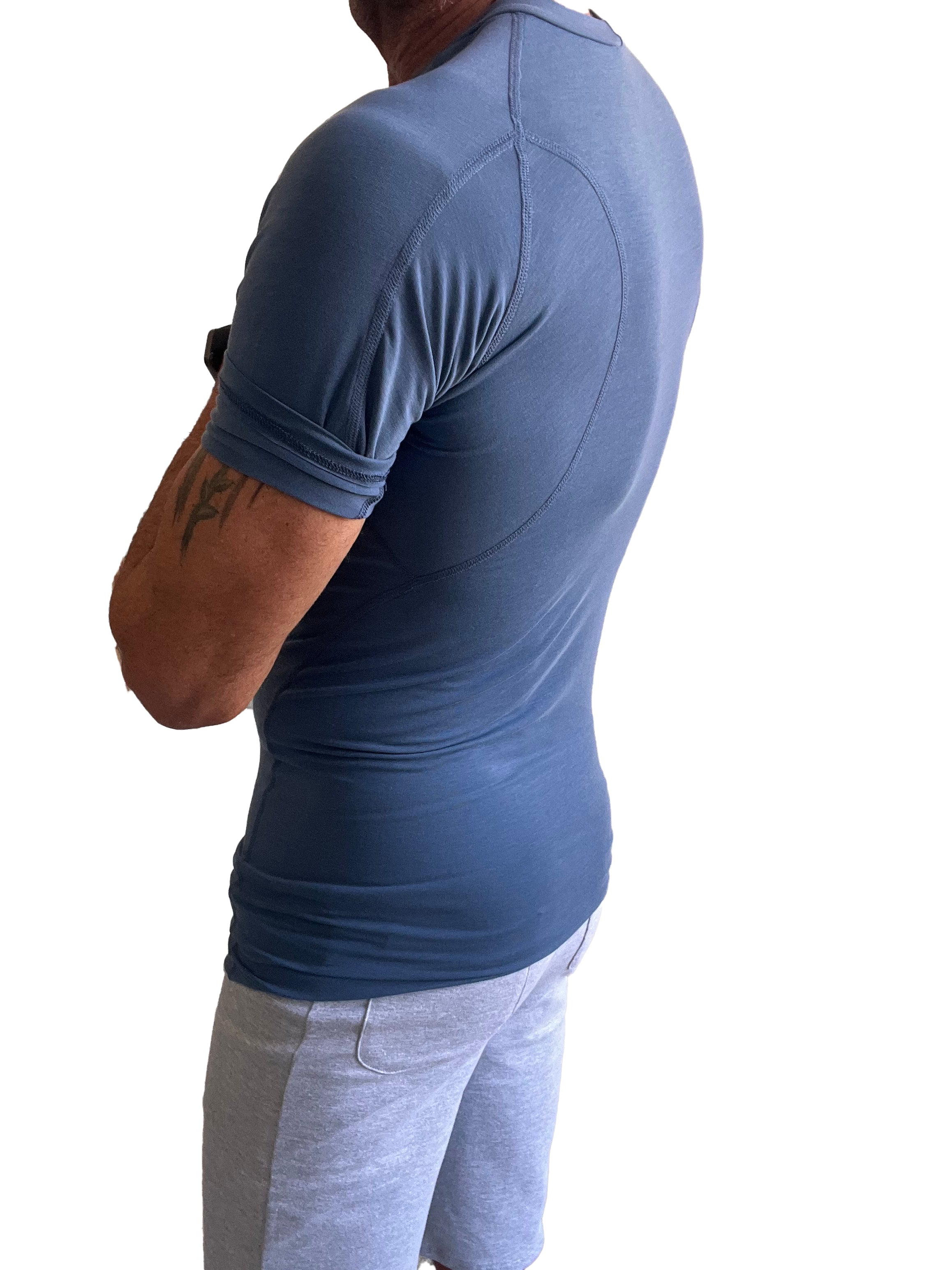 Designer raglan crew neck tee denim blue fitted short sleeved athletic shirt with subtle seams and elasticated cuffs