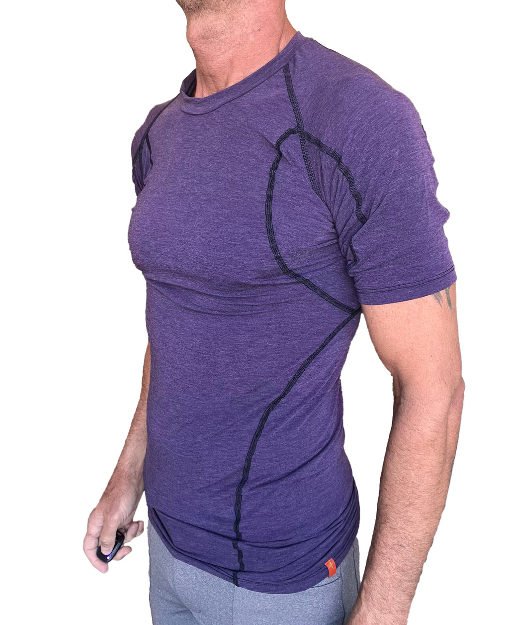 Designer raglan crew-neck eggplant purple short-sleeve athletic shirt with black seam detailing for active wear