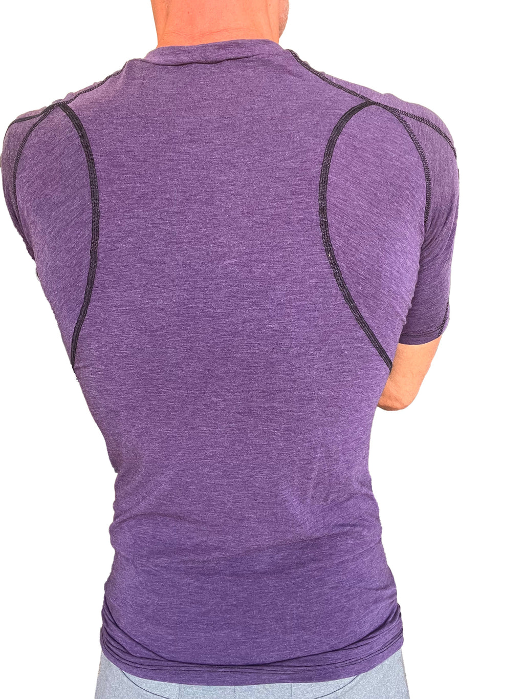 Designer raglan crew neck tee in eggplant purple with purple heathered compression fabric and black seam detailing