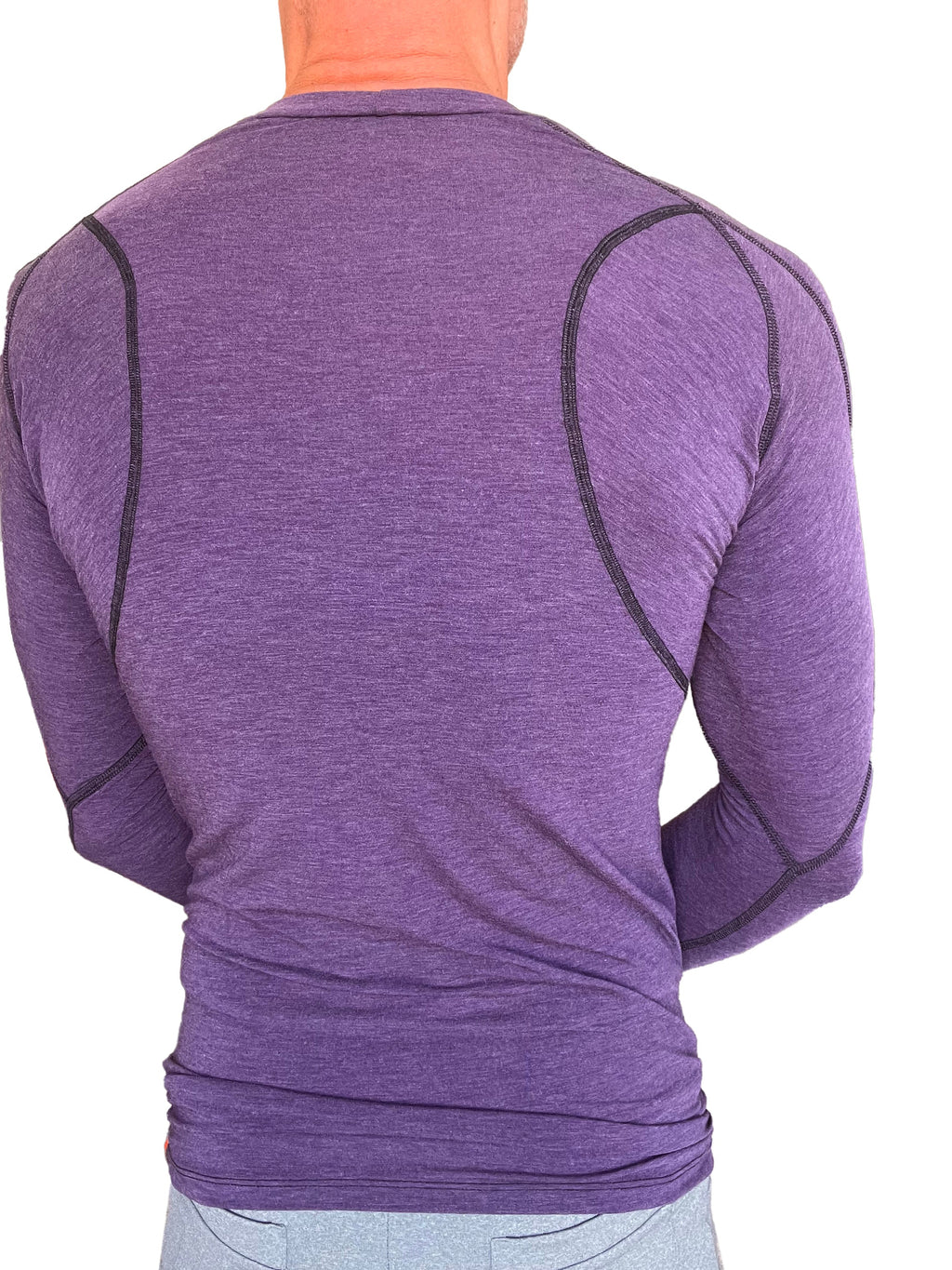 Designer raglan crew-neck long sleeve tee in eggplant purple with black seams and heathered fabric texture