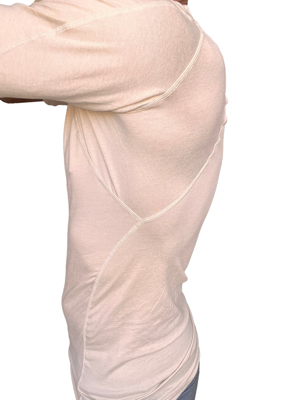A cream-colored designer raglan crew-neck tee with subtle seam detailing and a form-fitting athletic design