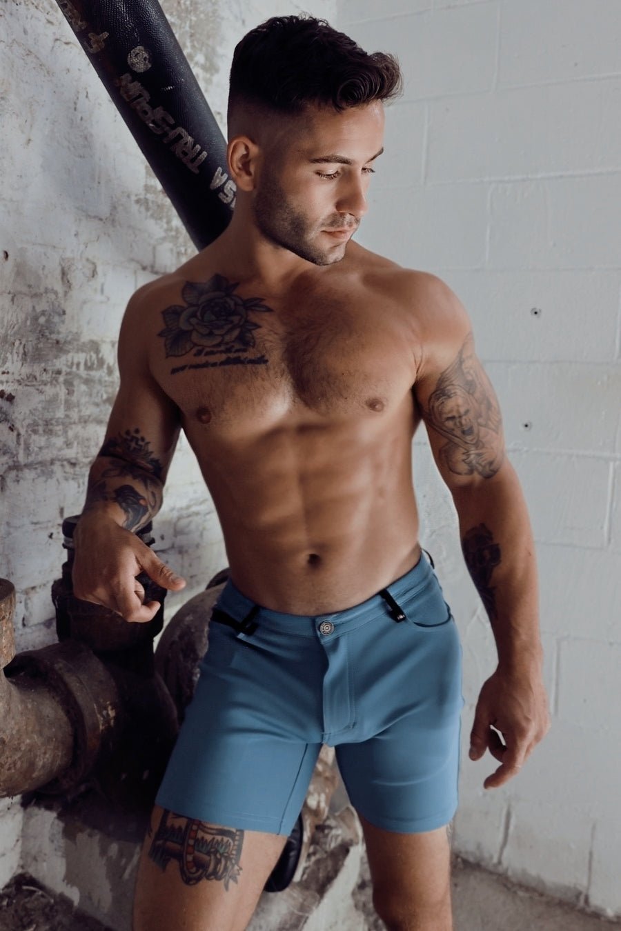 Blue denim down low shorts in slate blue with button closure and belt loops for casual wear