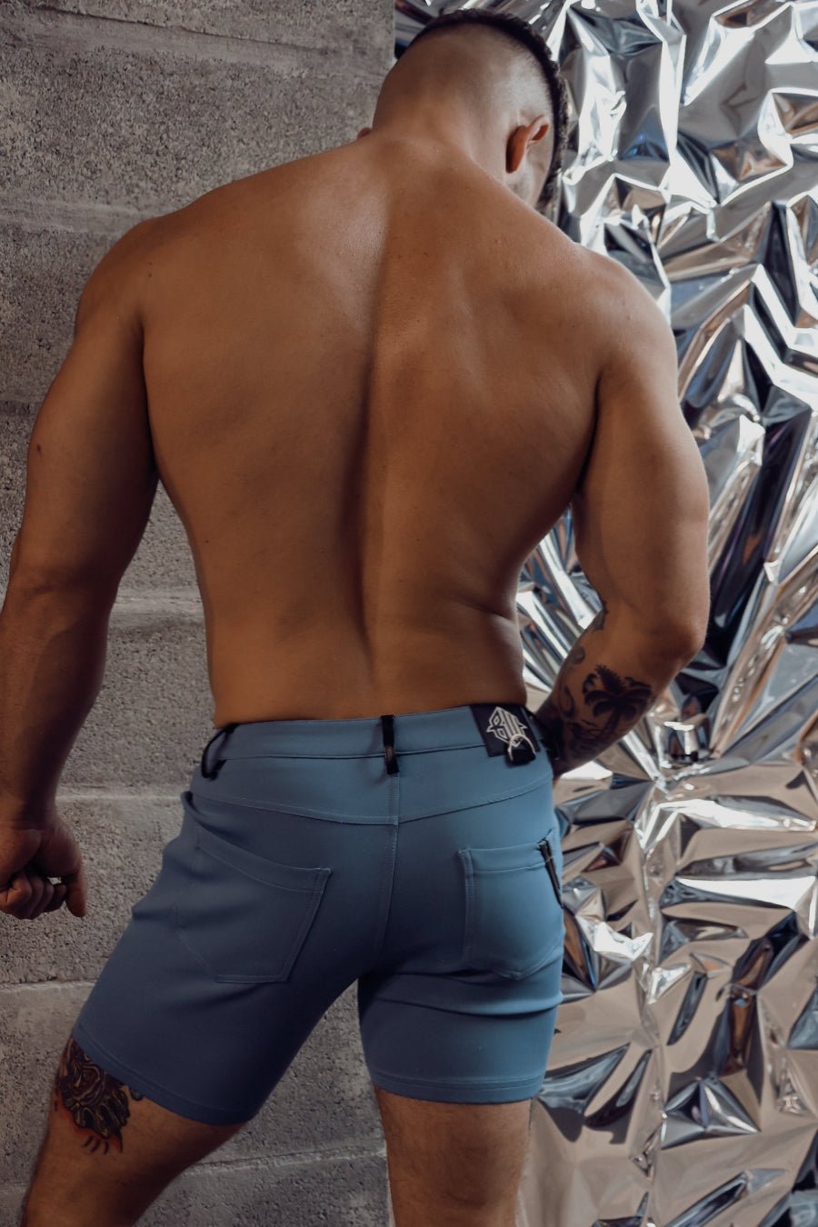 Blue down low shorts in slate blue with sleek modern design and subtle stitching details for athletic use