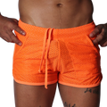Bright orange athletic mesh shorts with a drawstring waistband and side pockets.