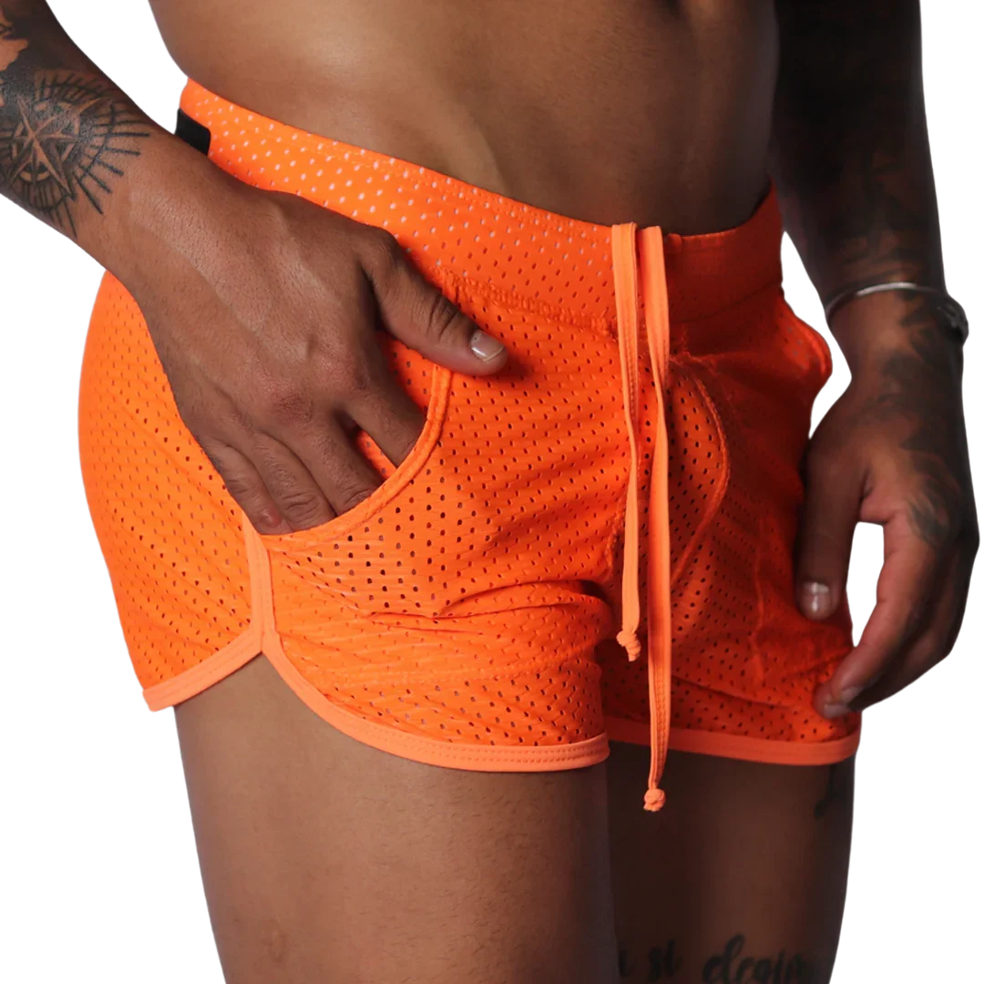 Bright orange athletic mesh shorts with a drawstring waist, curved hem, and side pocket detail.