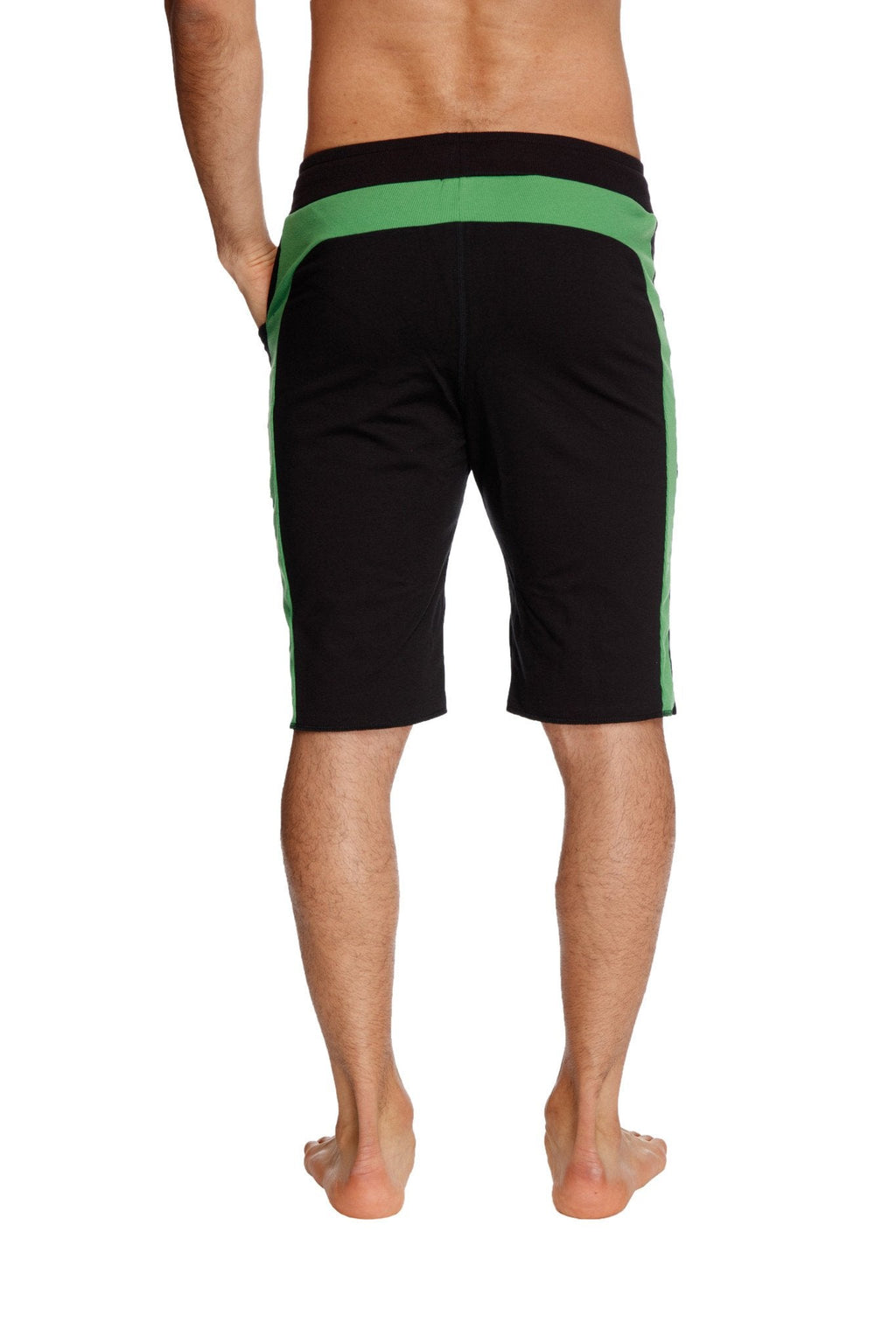 Eco track short in black with bamboo green waistband and vibrant green side stripes made from sustainable fabric