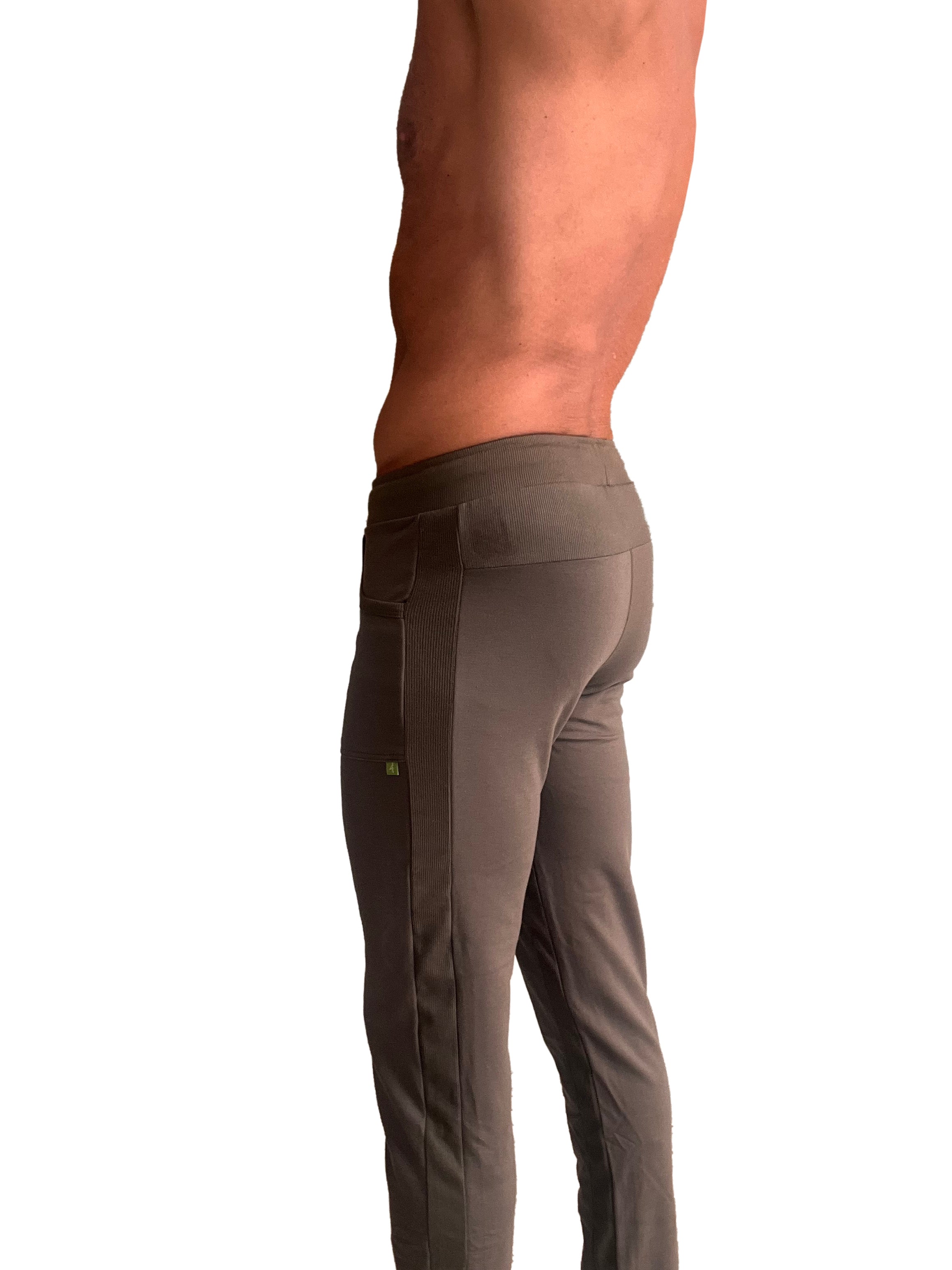 A pair of dark gray eco-track and yoga sweat pants with ribbed side panel and subtle thigh branding