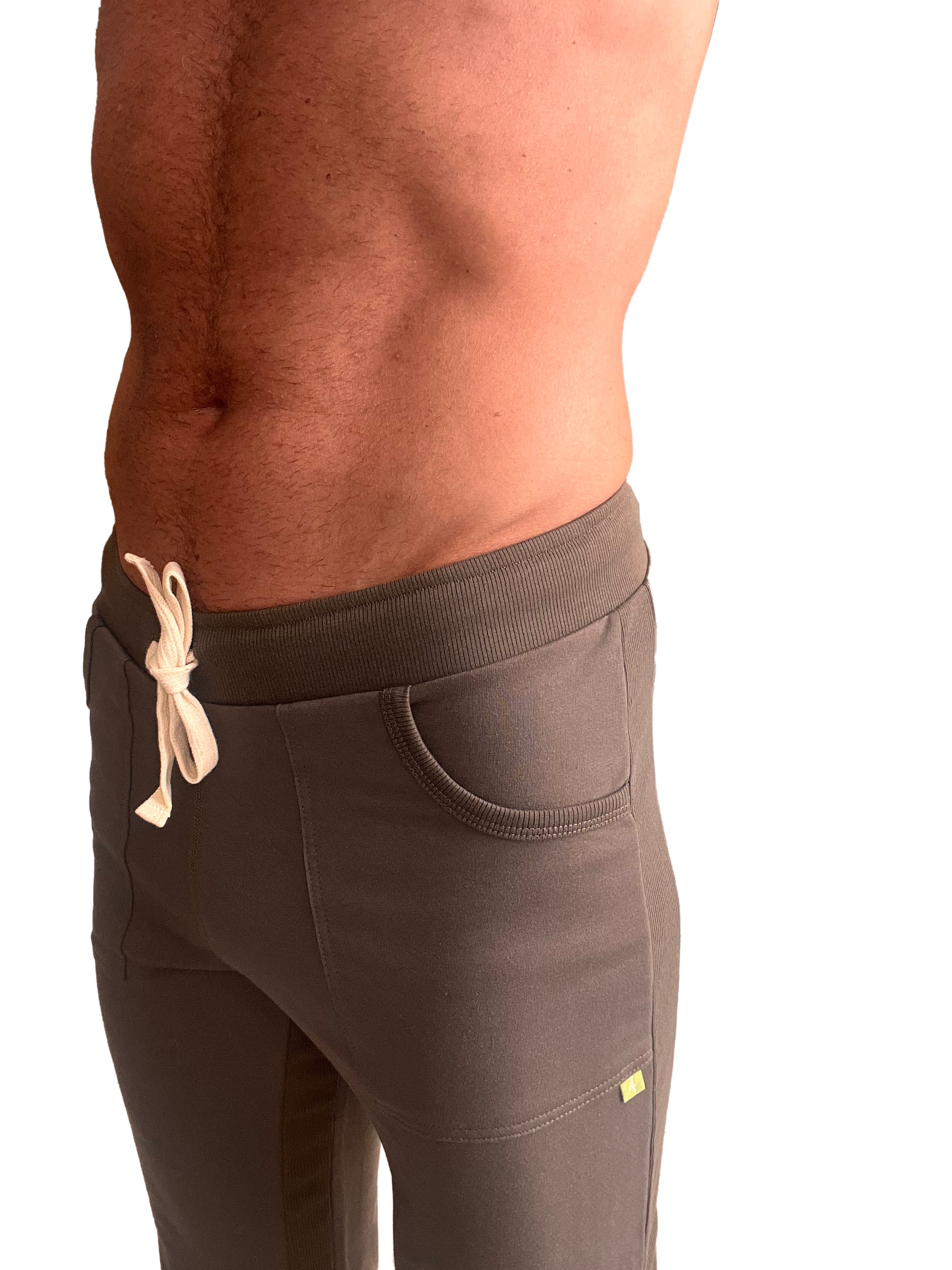 Brown eco-track and yoga sweat pant with ribbed elastic waistband and cream drawstring for athletic use
