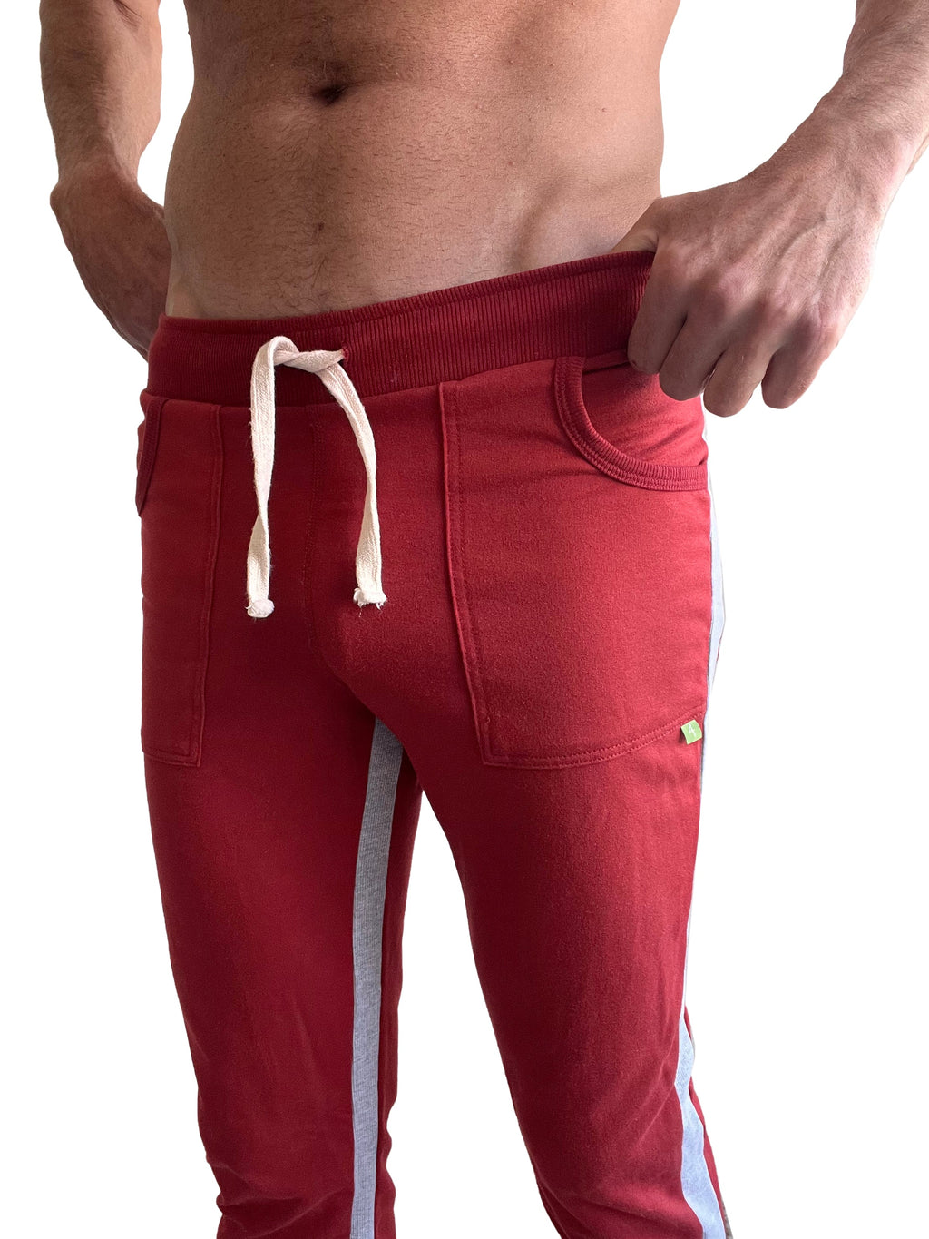 Eco-track and yoga sweat pant in cinnabar red with grey side stripes and white drawstrings designed for athletic wear