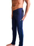 Navy blue eco-track and yoga sweat pants with black side stripes and a small green logo on the thigh