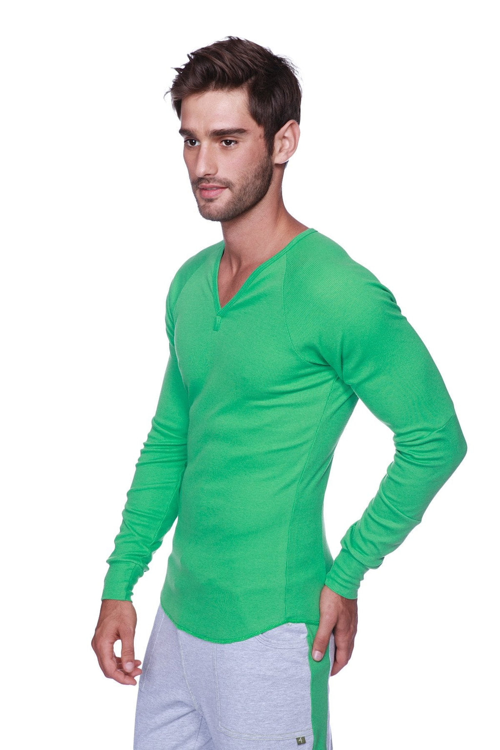 Vibrant green long-sleeved henley shirt with subtle textured fabric and button neckline paired with heather grey eco-track and yoga sweat pant