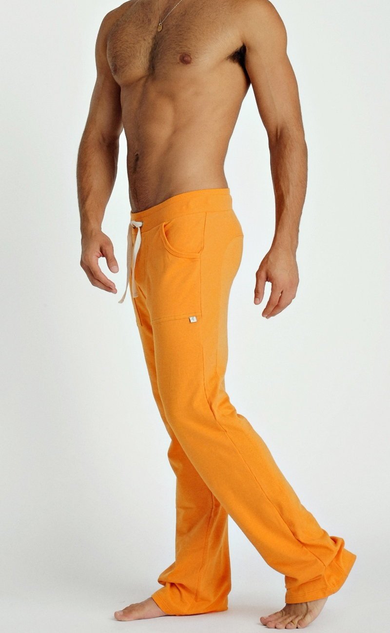 Eco-track & yoga sweat pant in sun orange with white drawstring and side pockets designed for athletic use