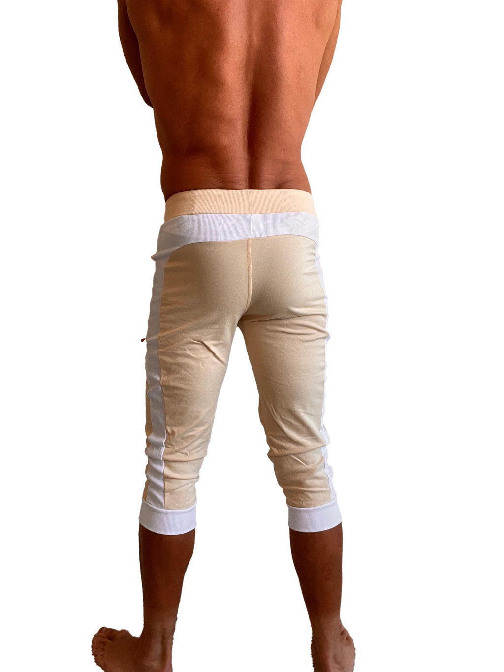 Edge cuffed yoga pants in sand beige with white piping trim at waistband cuffs and side seams for active wear