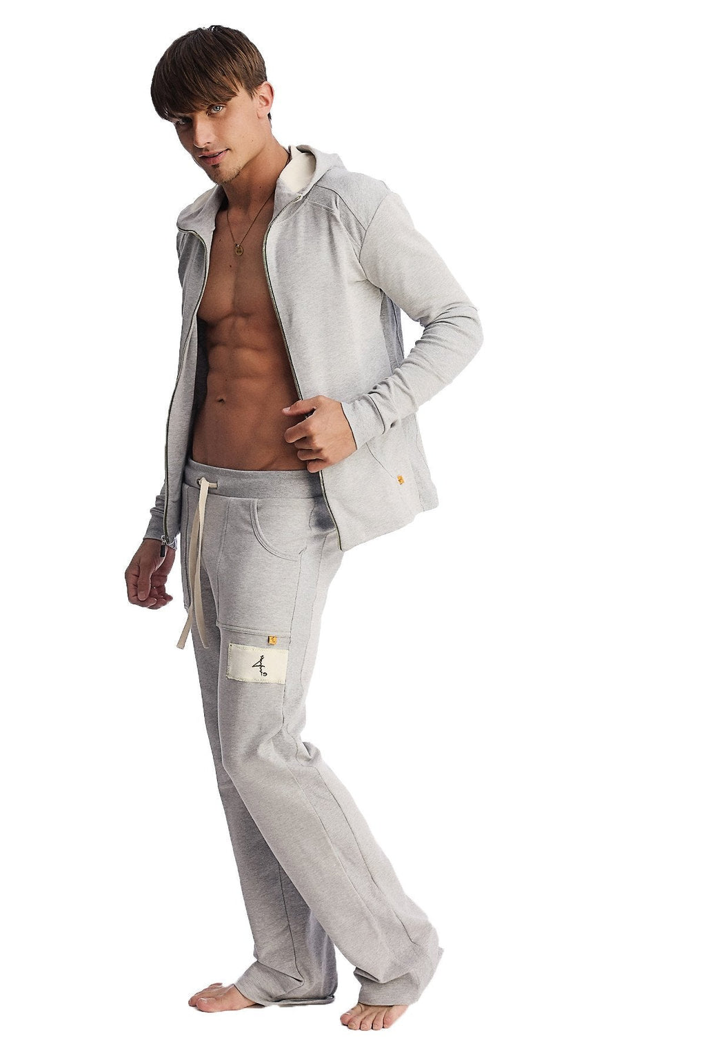 Light gray heather eco track and yoga sweat pant with a front zipper hooded sweatshirt and subtle gold branding