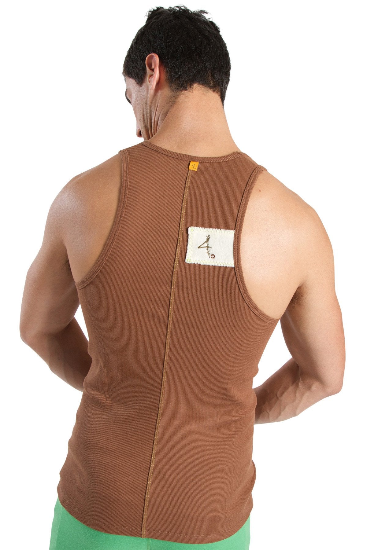 Back view of brown ribbed edge sustain tank top with white label showcasing sustainable fabric and fit