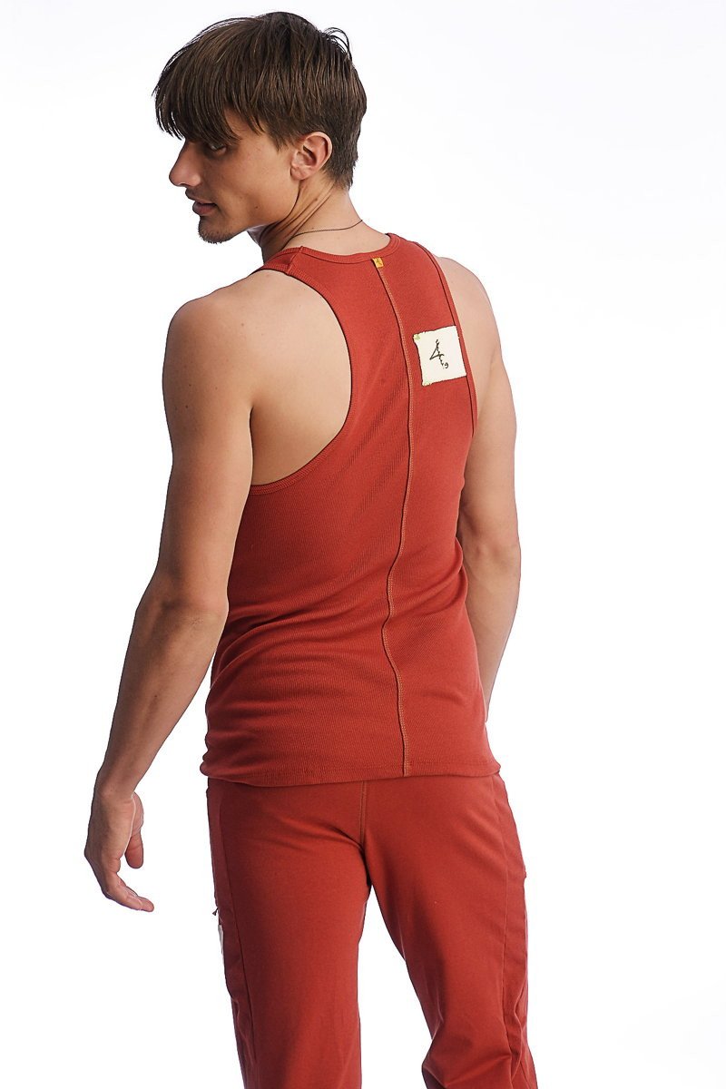 Back view of edge sustain tank top cinnabar with rust red color and central zipper detail near neckline