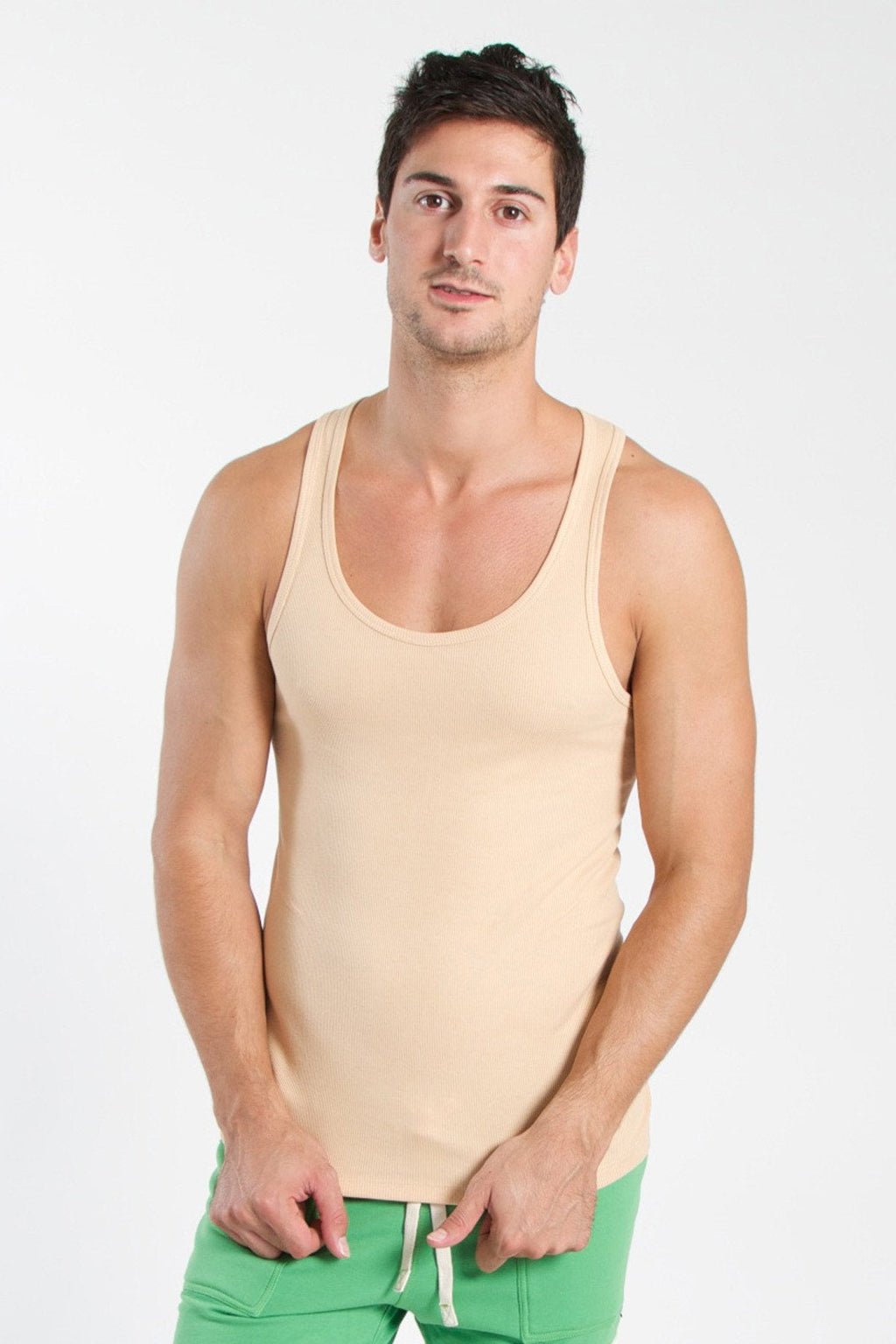 Beige sleeveless edge sustain tank top with rounded neckline and subtle ribbed texture in sand beige color