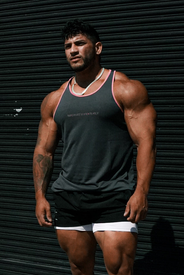 Dark gray fast-dry bodybuilding workout stringer tank top with pink trim and subtle white logo on the chest
