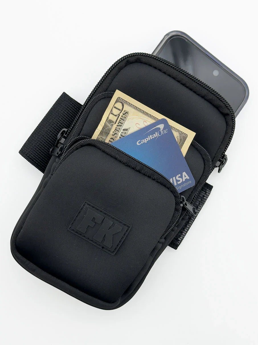 Black fk sport 3 pocket neoprene arm pouch with zippered compartments holding cash and phone for active use