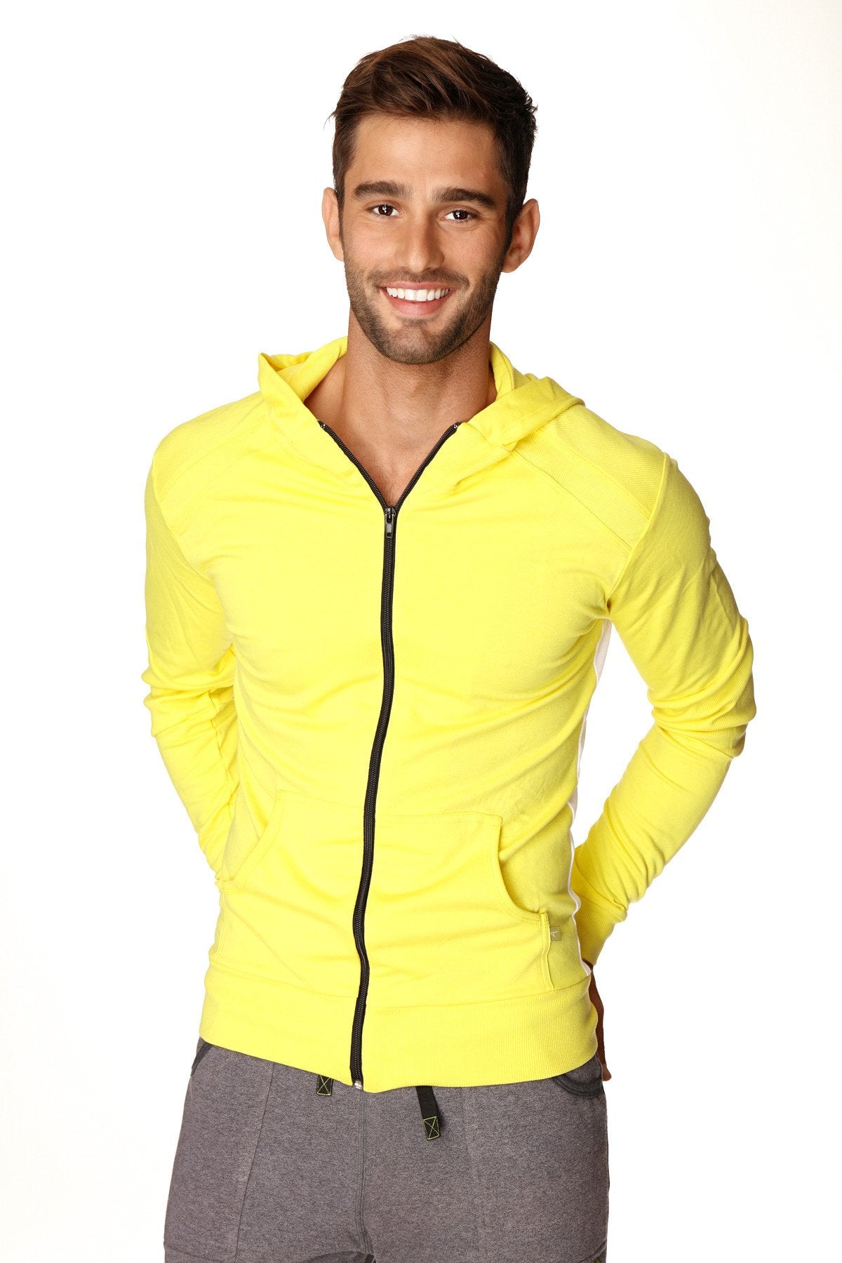 Form-fit crossover yoga track performance hoodie in tropic yellow with black zipper and front pockets for active wear