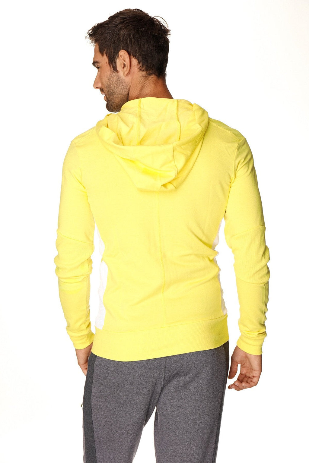 Bright yellow form-fit crossover yoga track performance hoodie with hood long sleeves and ribbed hem in tropic yellow w white