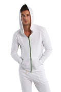 White form-fit crossover yoga track performance hoodie with green zipper and matching drawstring for activewear