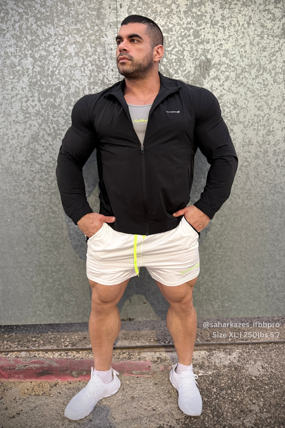 Full-zip training jacket in black with a subtle chest logo designed for comfortable workout wear