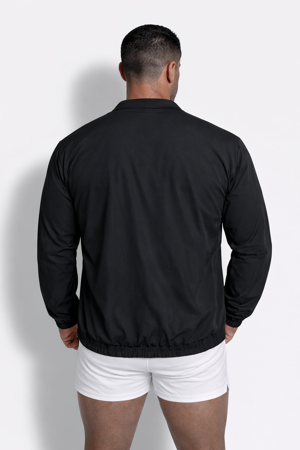 Black full-zip training jacket with long sleeves lightweight fabric ribbed hem and collar for active wear