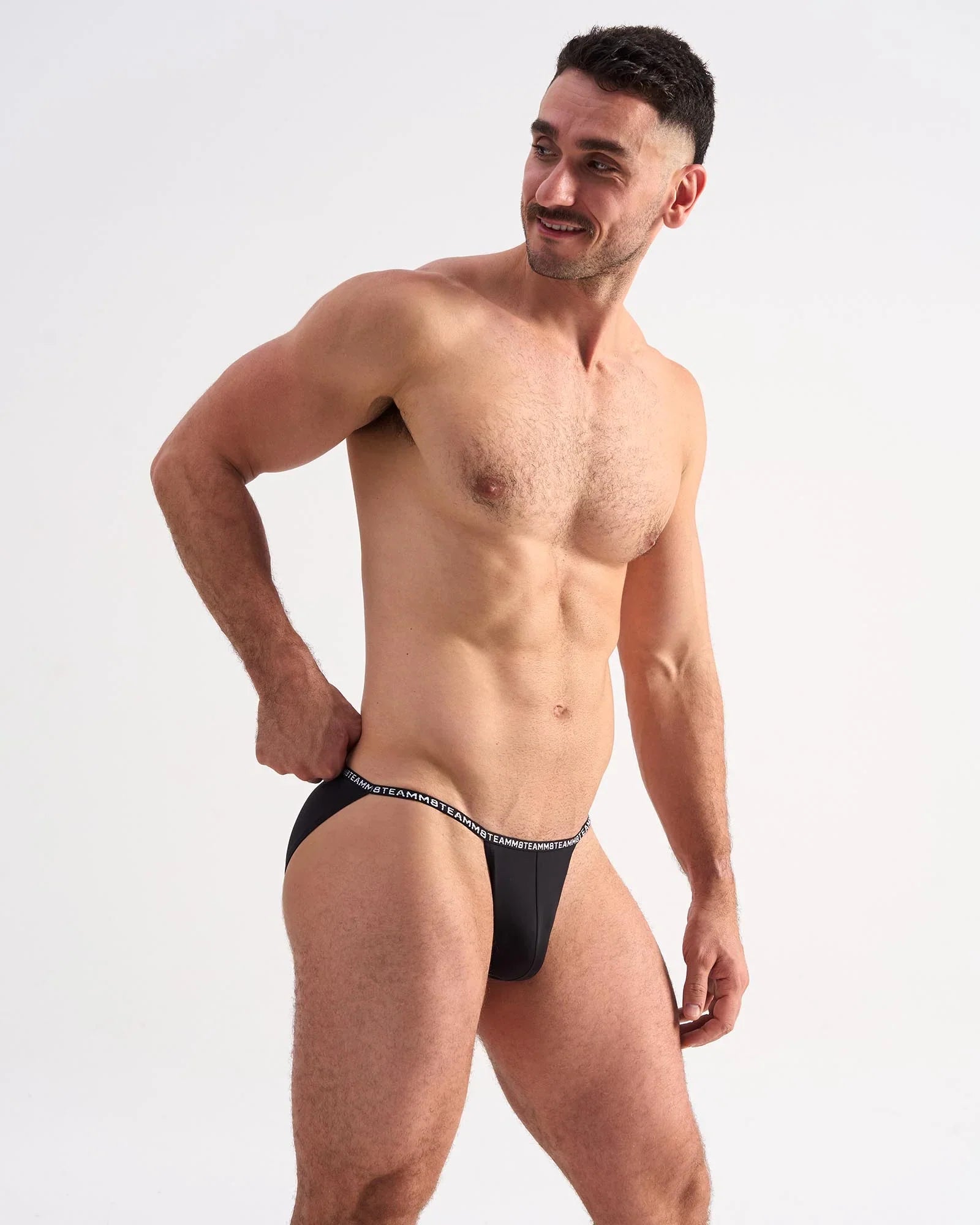 Black glide micro brief with white elastic waistband featuring repeating text for comfortable daily wear