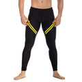 Black gigo core leggings with bold yellow diagonal stripes on outer thighs for athletic performance