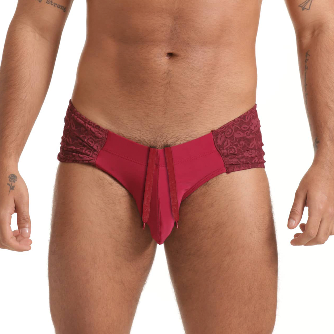 A vibrant fuchsia gigo hindu wine swim brief with lace trim and central drawstring for men