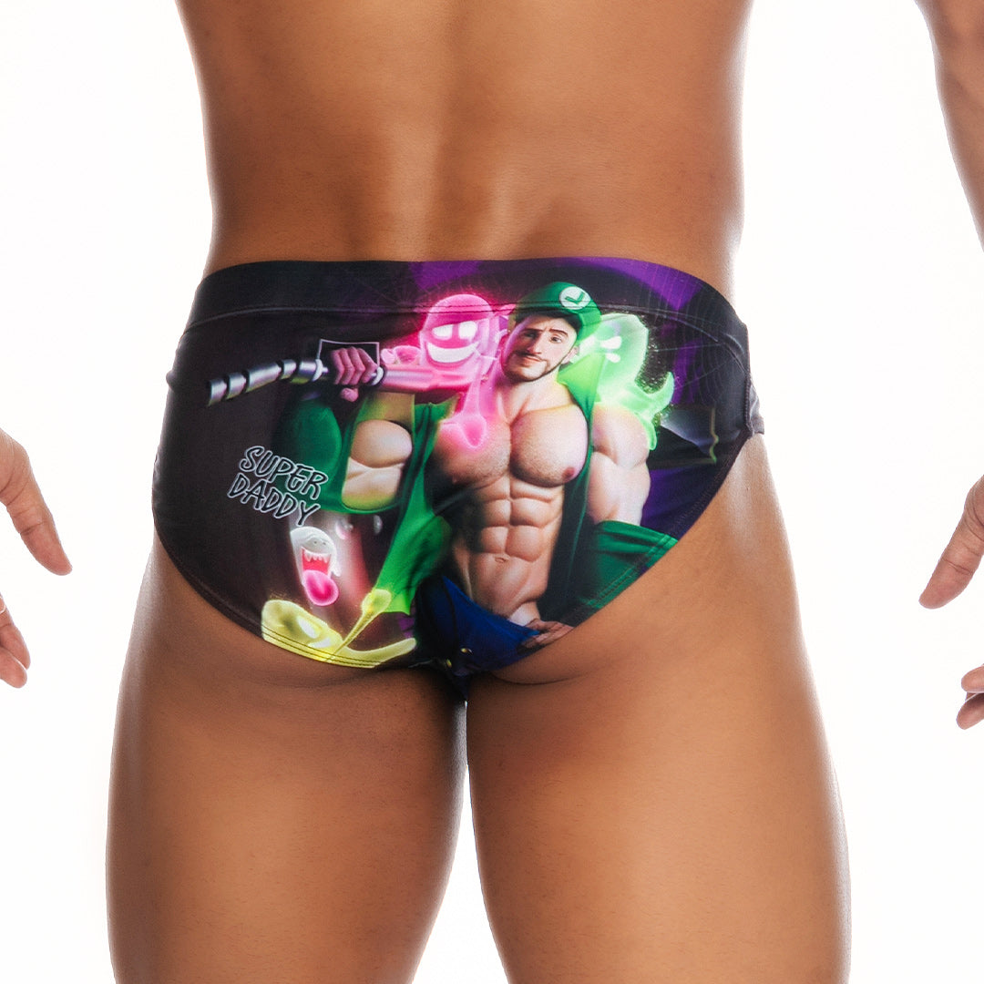 Black gigo super daddy purple swim brief featuring vibrant graphic of muscular man with pink weapon and text super daddy