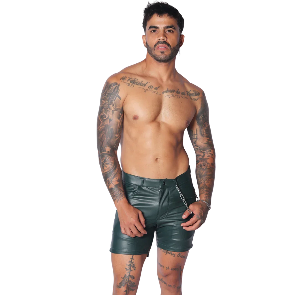 Men's dark green faux leather fitted shorts with a zipper closure and a silver chain accessory at the waist.