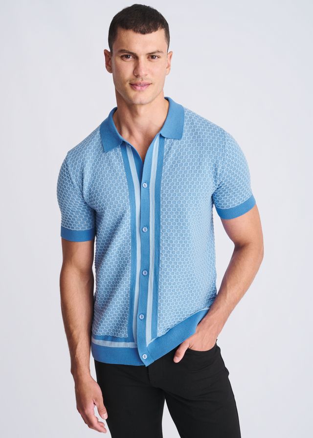 Light blue short-sleeved knit polo shirt with honeycomb texture and darker blue trim on collar placket cuffs and hem