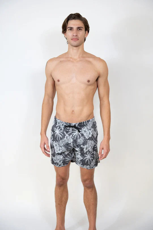 Men’s dark gray Hawaiian print swim shorts with white tropical leaf pattern and black drawstring waistband