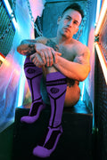 Purple and black knee-high hook up socks with bold geometric design and redwell brand printed across the calf